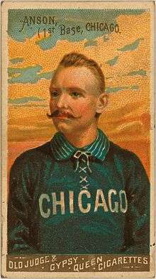 Baseball card depicting a half-length portrait of a mustachioed man in a blue baseball uniform