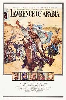 A painting occupies about 3/4 of the frame. A man riding a galloping horse across sand is the most prominent image. The man is holding a raised scimitar in his right hand; he is wearing a white robe, suggestive of Arabian clothing, but looks to be European with blond hair. Behind him are many more mounted men charging with raised swords, extending far into the background and a sandy hill. At the top of the painting, which shows the sky above the hill, the words "Lawrence of Arabia" are written using a large, formal font suggestive of printing. Two lines of small lettering above these words have the phrases "After five years .... the first motion picture from the creators of 'The Bridge on the River Kwai'" and "'Columbia Pictures presents the SAM SPIEGEL - DAVID LEAN production of'". Beneath the main painting are a row of five small painted portraits of five men wearing Arabian and European dress; one is the same man leading the charge in the main painting. Beneath these paintings is the billing block of the poster: "starring Alec Guinness - Anthony Quinn / Jack Hawkins - Jose Ferrer / Anthony Quinn - Claude Rains - Arthur Kennedy / with Omar Shariff as 'Ali' - introducing Peter O'Toole as 'Lawrence' / screenplay by Robert Bolt - produced by Sam Speigel - directed by David Lean / Photographed in Super Panavision 70 - a horizon picture in Technicolor".