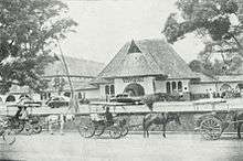 A one storey building, photographed from below